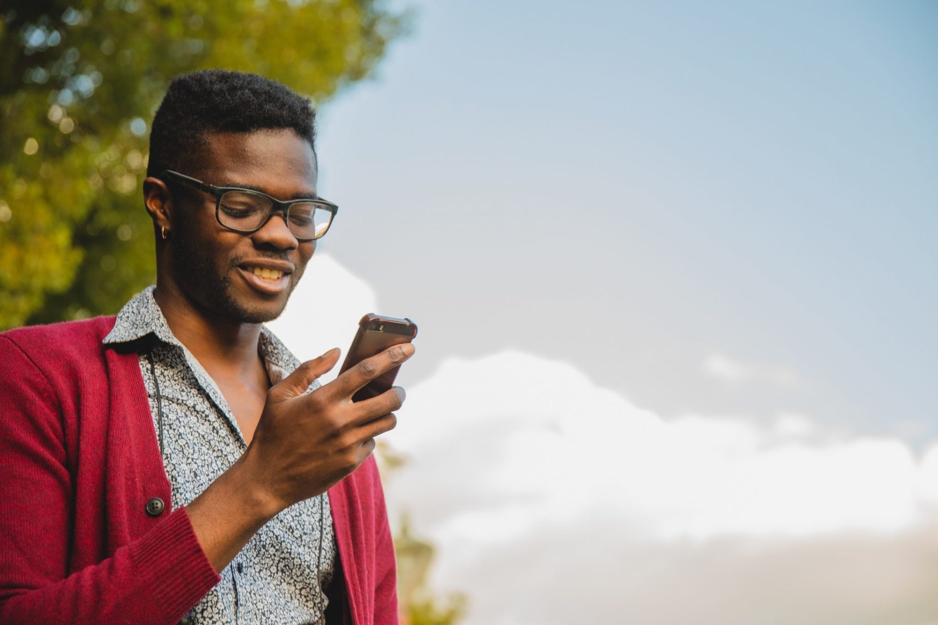 man phone happy outside