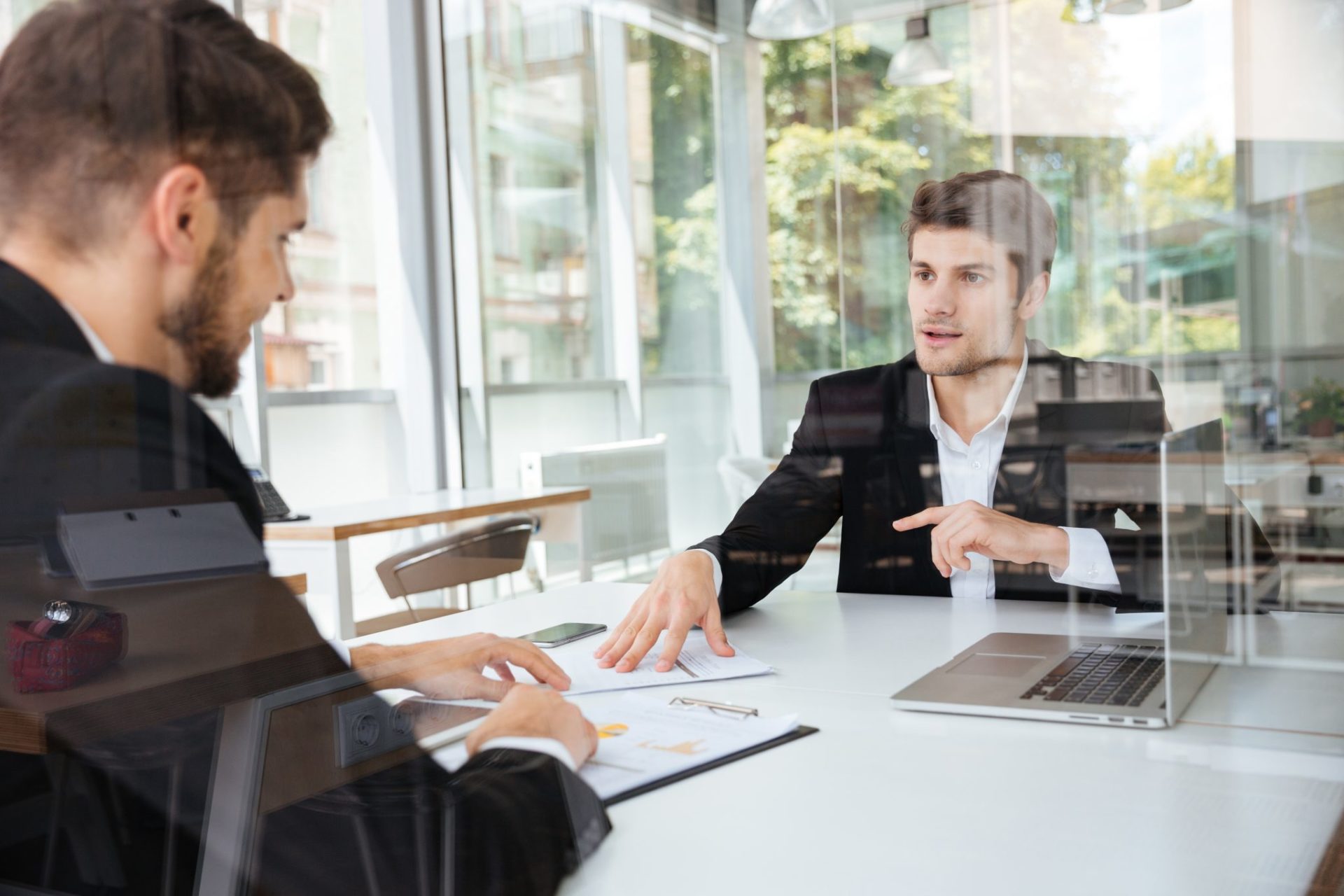 two business men Is data the key to workplace mental health and wellbeing?